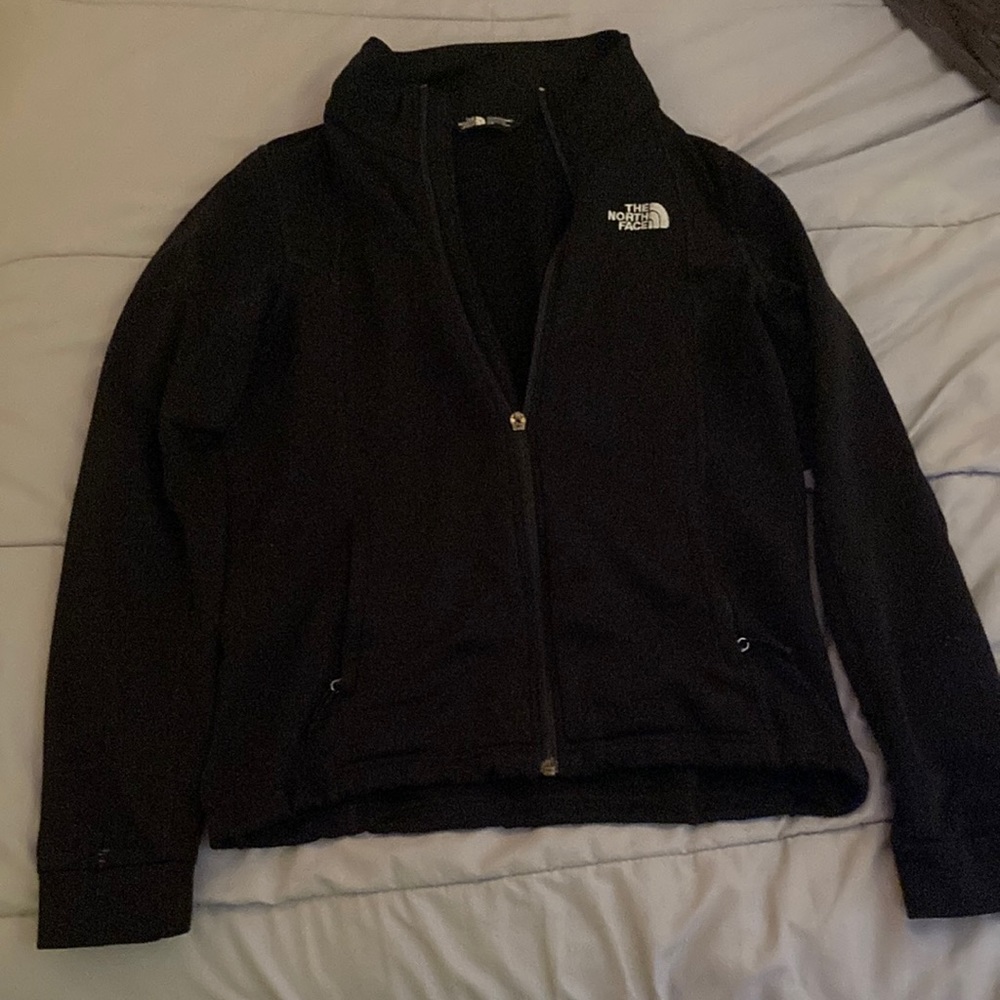 Black “The North Face” brand zip up sweatshirt